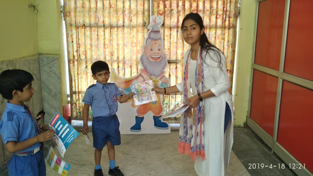 Students receiving their GullyBaba Kids books and certificates