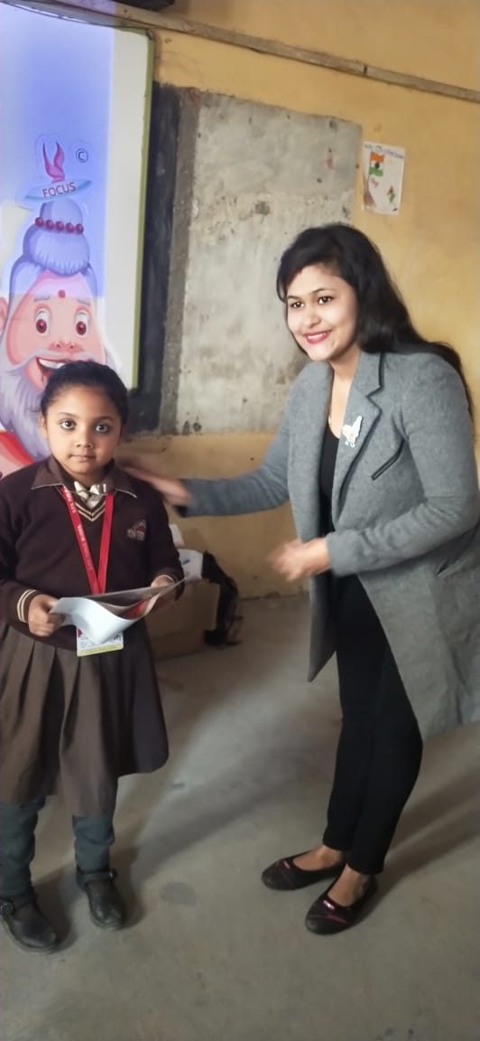 A student being felicitated during a school workshop